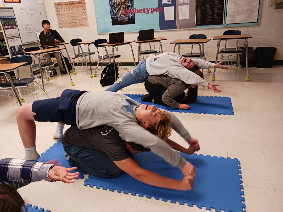 BuehlerMhs's tweet photo. Taking care of the social-emotional skills: The empathetic reader is emotionally impacted when reading Elie Wiesel's Holocaust memoir, Night. We had to take a break from the novel around Ch. 4 and recenter ourselves with partner yoga and poetry. Laughter ensued. 😊 https://t.co/jBDcLzAfYB