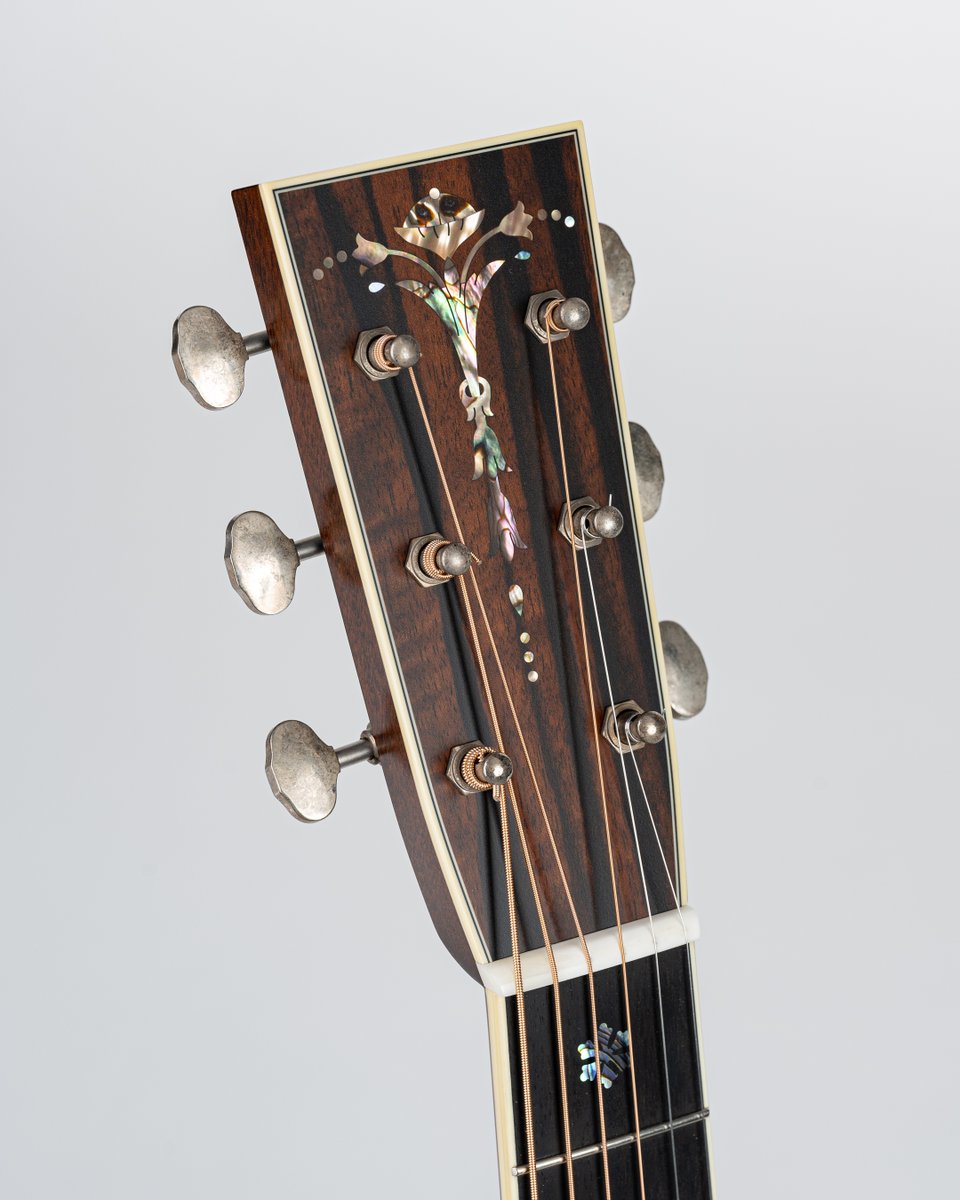 The peghead from yesterday's post belongs to this decked out D42 A SB T S featuring a torrefied Adirondack top with 2-style burst, 45-style snowflakes, and SO much more... Available now at Eddie's Guitars. #handmade #acousticguitar #atx #collingsguitars