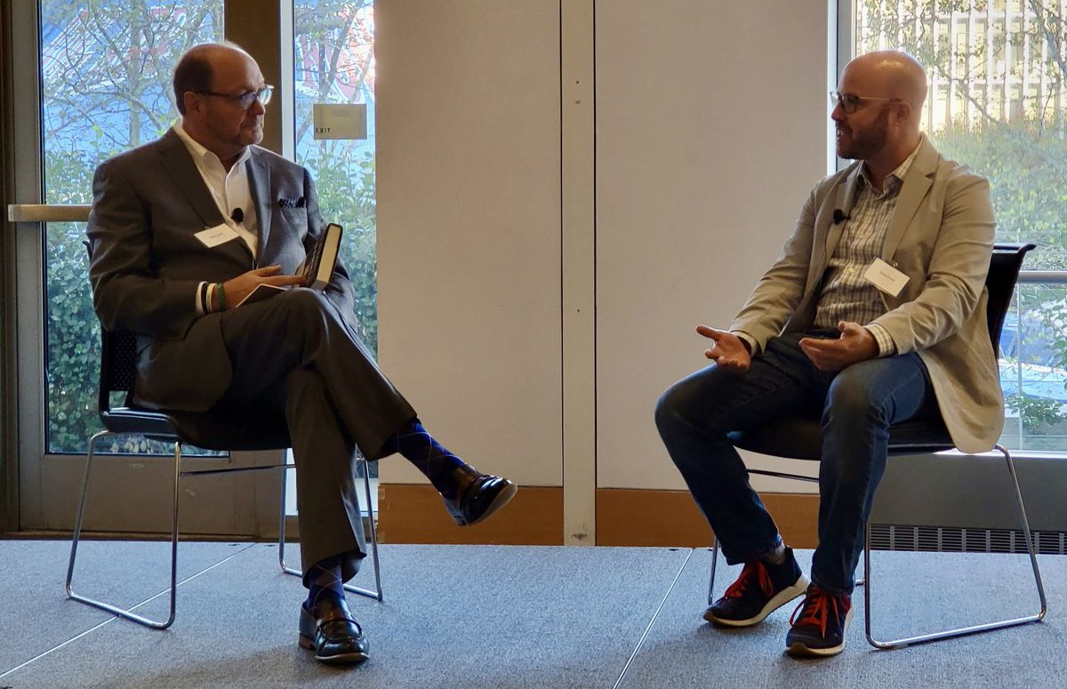 SteveScottNEWS's tweet photo. It was my pleasure to moderate today’s keynote presentation by @davidenrich of the @nytimes. It was a fascinating discussion. Everyone in attendance at the Journalism Conference got a copy of David’s book, “Servants of the Damned.” @NYPressClub @JournalistsNY 📷: @mollystarkdean https://t.co/N6GPRn4juS