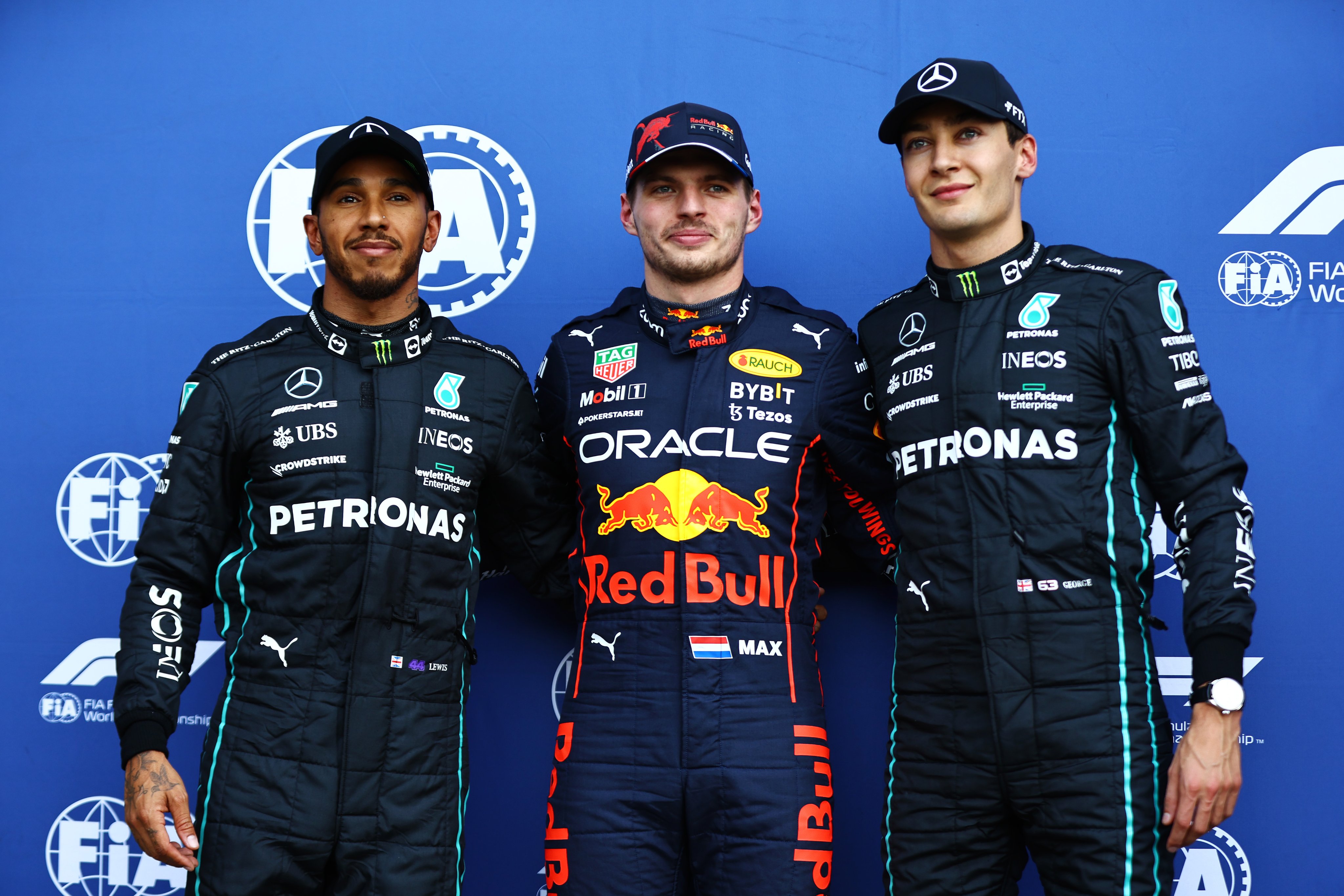 A photo of Lewis Hamilton, Max Verstappen and George Russell all stood from left-to-right, after qualifying in Mexico