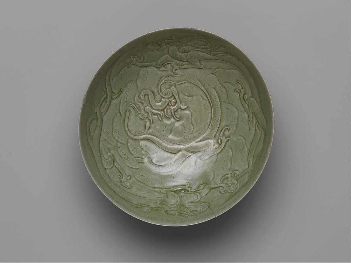 Yue Ware Bowl with Dragons among Waves, Five Dynasties (907–960)

Stoneware with carved and incised decoration under celadon glaze
 
#Met #Antiques #ChineseArt
