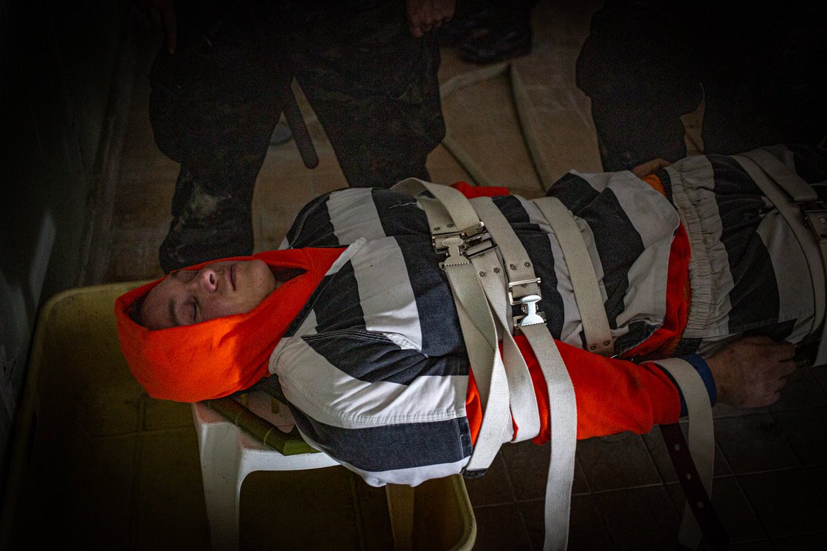 BoundMuscleUK's tweet photo. @skINMATE @firebravo A continuation of this story, by far my harshest treatment! Strapped down to a board by 7 German prison guards after being forced to learn German. I was then led off to be waterboarded, it was amazing but harsh! This was also on my birthday! https://t.co/IjfNdidhUC