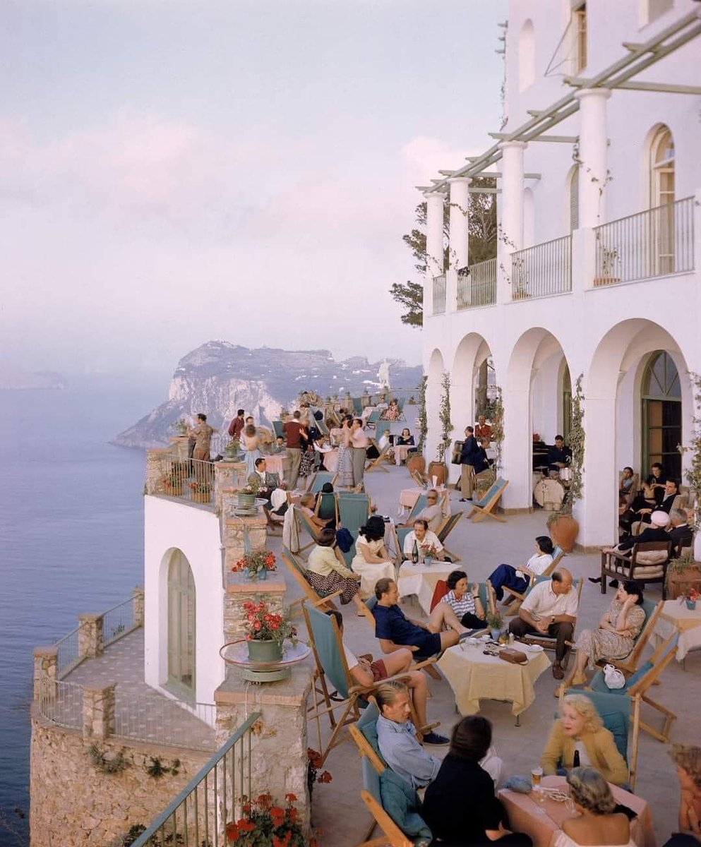historydefined's tweet photo. A terrace at a cafe in Capri, Italy, 1949. Photo by Ralph Crane https://t.co/3K0v4ZtoTi