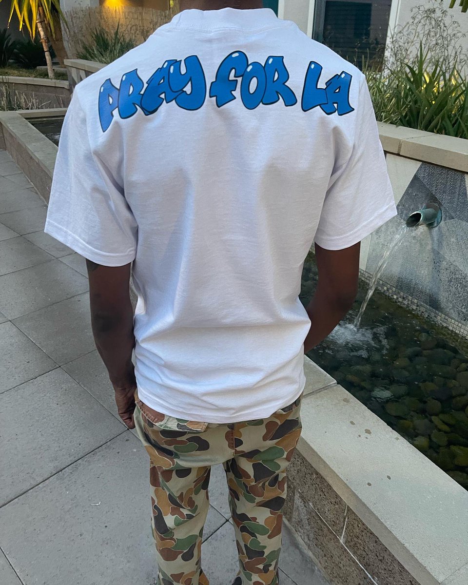 ReveaLosAngeles's tweet photo. #PrayforLA tee available now at https://t.co/QQRICGZFc9 🙏🏾💙 https://t.co/WUQjyAiKrM