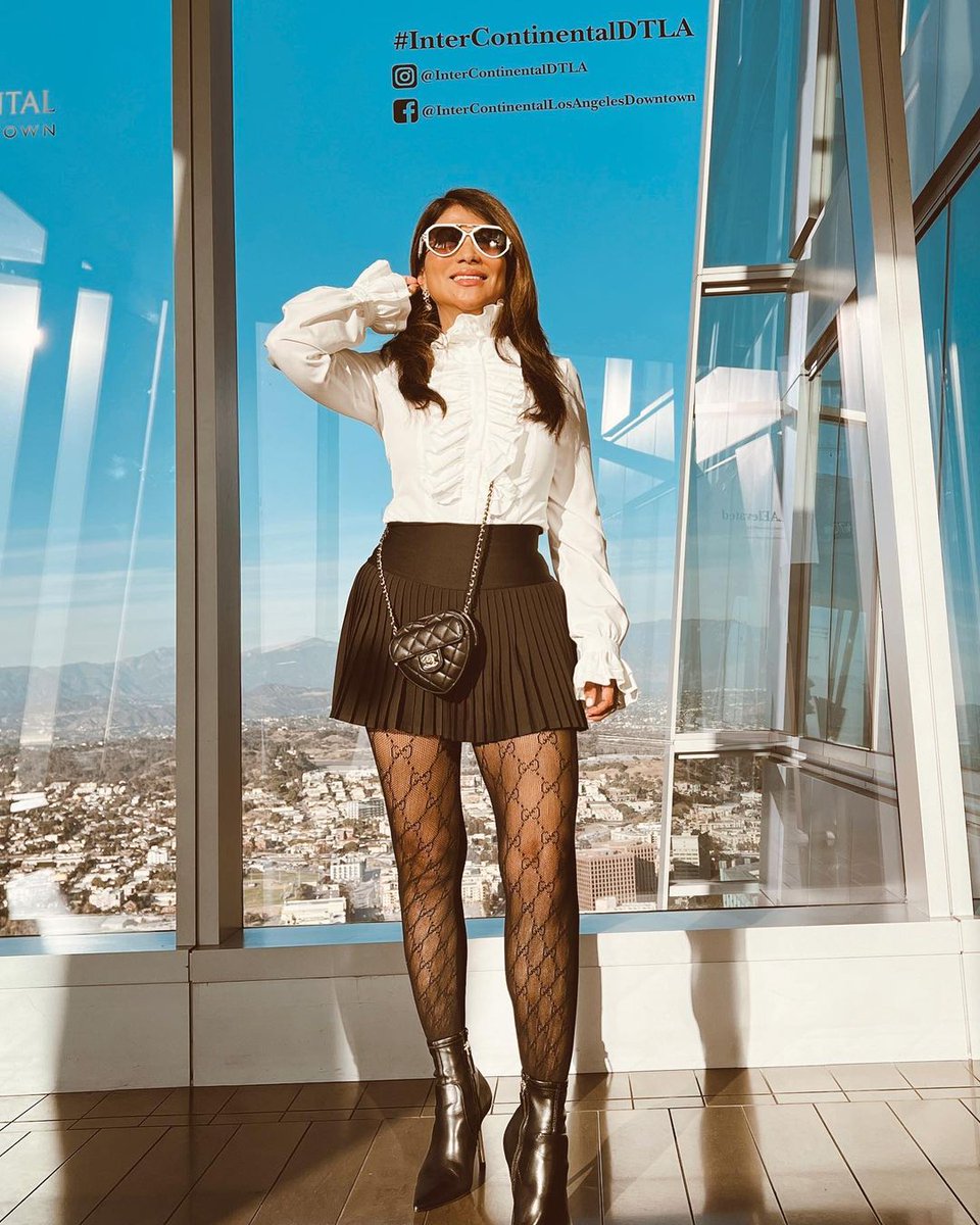 Downtown LA today 85 degrees and sunny #SundayBrunch All Chanel black and white look, Gucci Tights & boots