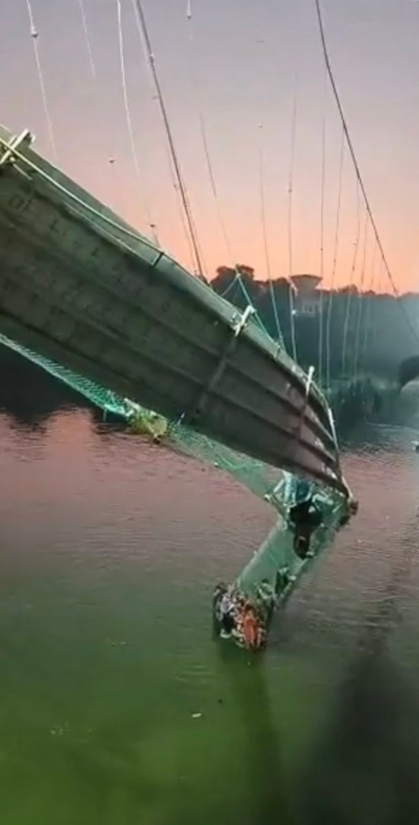 143-year-old Morbi cable bridge collapsed in Gujarat. Till now 60 dead & counting 1. On 26 Oct: It was reopened after repair & renovation. Who gave fitness certificate? If certificate was not given, who approved reopening? 2. Who allowed people on bridge more than its capacity?