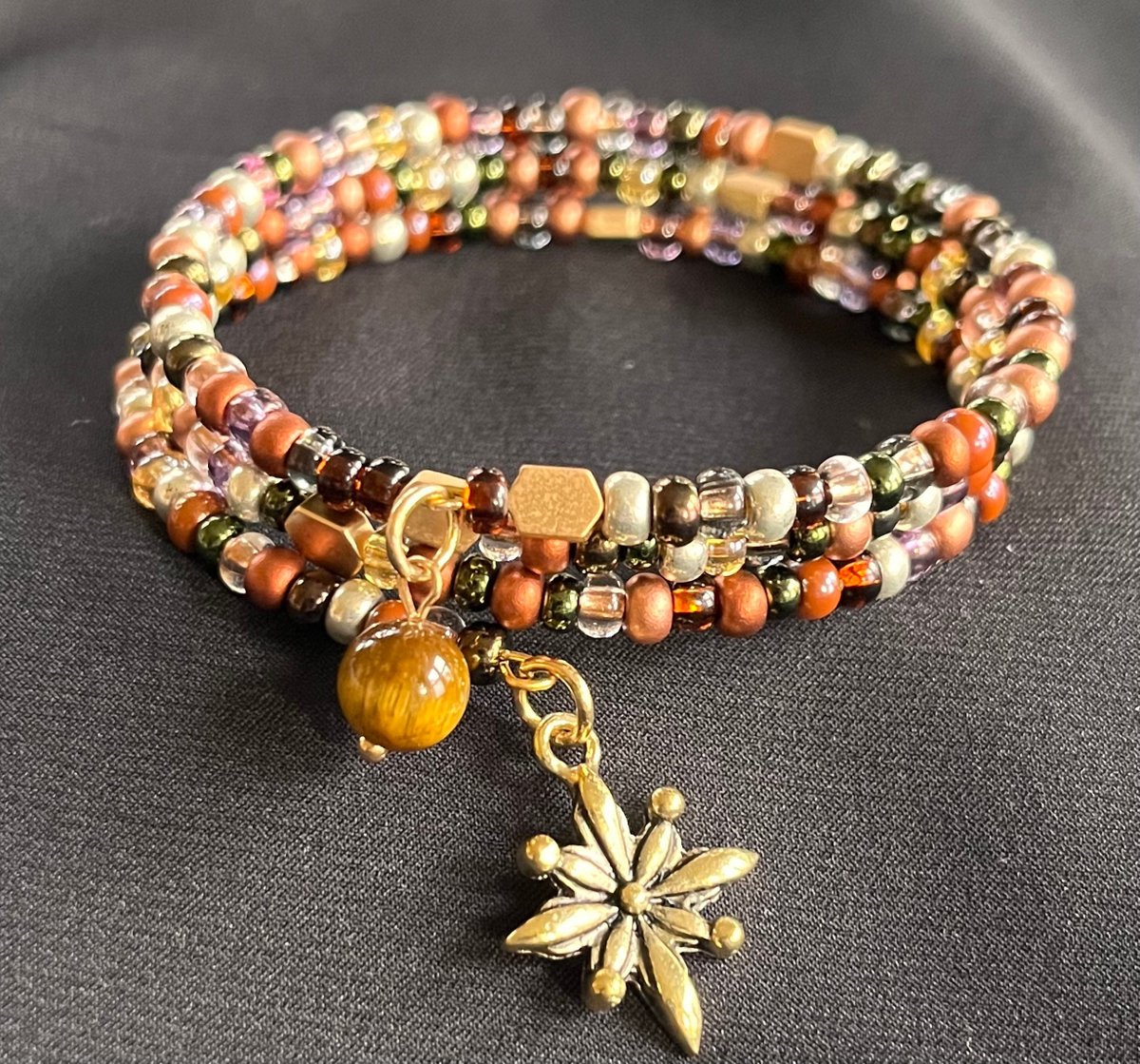 caverin1's tweet photo. Excited to share the latest addition to my #etsy shop: Copper and Gold Colored Glass Bead Autumn Wrap Bracelet with Autumn Charms https://t.co/eoLk5oCWnL #copper #round #gold #glass #czechglassbeads #fallcolors #autumn #topaz #wrapped https://t.co/s22XH3LLmS