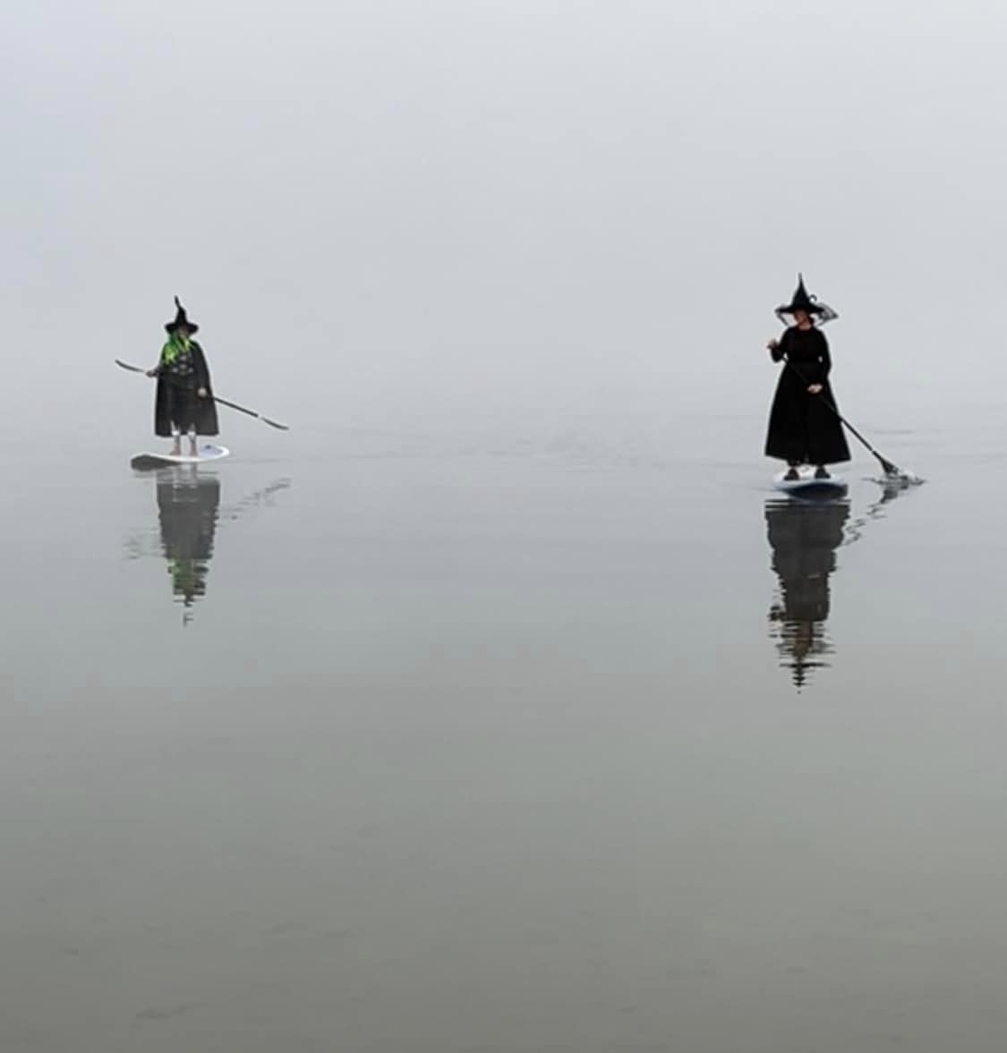 🧙‍♀️ What a cool, eerie photo! Two "witches" were spotted paddleboarding on Newfound Lake in Grafton County. / 📸: Tara Talamini | u local