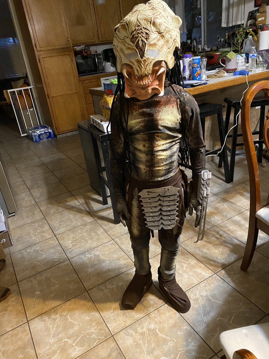 BushBanshee's tweet photo. lol my son this year. His dad made the helmet and skirt. #Predator #PreyMovie https://t.co/g8RnIOXZuW