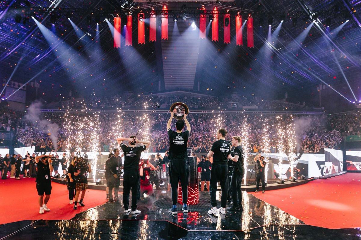 co_mama's tweet photo. My boys bookending the #TI11 winners perfectly encapsulates the past 4 weeks for our family. What a treat to watch them work side by side. Behind the lens starting in Germany, @philcoradio aimed to capture the humanity and passion behind these young men. 1/2 https://t.co/duAXykCSCx