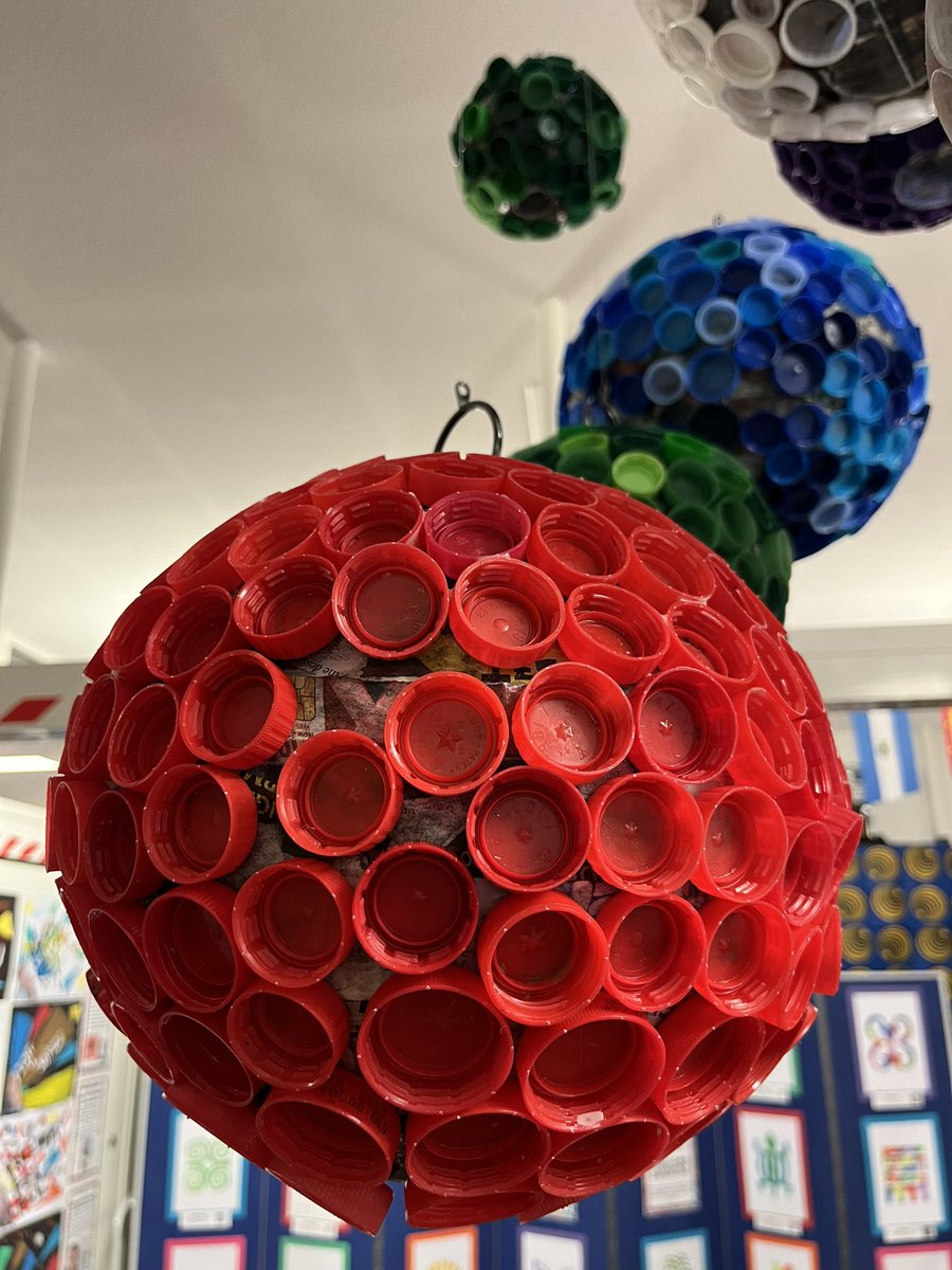 So Year 6’s learning is about everyone’s right to a safe and healthy environment. 

The children studied the artist Serge Attukwei Clottey, who works with recycled materials. Everyone in the school collected bottle tops, which the children used to create these stunning spheres.