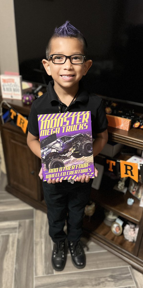 julesmcastaneda's tweet photo. Caleb was hoping his book would arrive on time. He LOVES Mohawk Warrior and was determined to dress up like the driver @BryceKenny of course he needed his signature Purple Mohawk. Ready for the Character Parade @Rockets120 https://t.co/6uz3dCkQwk