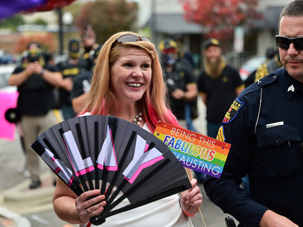 When a family with a little girl in a Wonder Woman costume came down the sidewalk, the Proud Boys all whipped out their cameras and pointed at them. The girl was face-to-face with these men until the event host stepped in between to welcome the family inside.