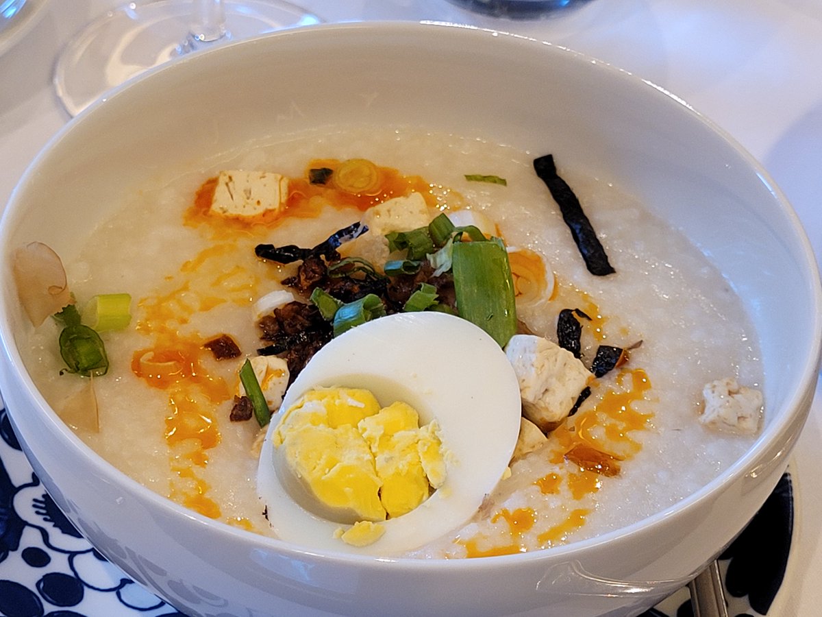 I'm still thinking about this amazing Asian Congee that I enjoyed for breakfast aboard the Nieuw Amsterdam, <a href="/hollandamerica9/">HollandAmerica Line</a> .

This rice porridge was flavored with ginger, tofu, chicken, scallions, and hard boiled egg. It hit just right on a windy, chilly morning!