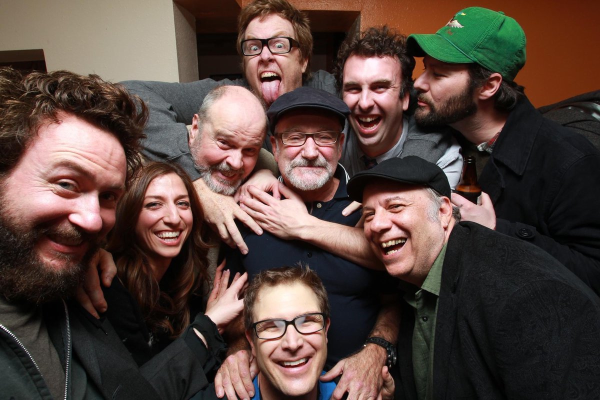 SFSketchfest's tweet photo. #SketchfestFlashback 2012, 11th fest: Robin Williams surrounded by friends and comics Brendan Walsh, Chelsea Peretti, Rick Overton, Steve Agee, Matt Braunger, Jon Dore, Eddie Pepitone &amp; Troy Conrad backstage at Cobb’s. Photo: Jakub Mosur.SF Sketchfest returns Jan.20 - Feb.5, 2023 https://t.co/EVoiOxWfmW