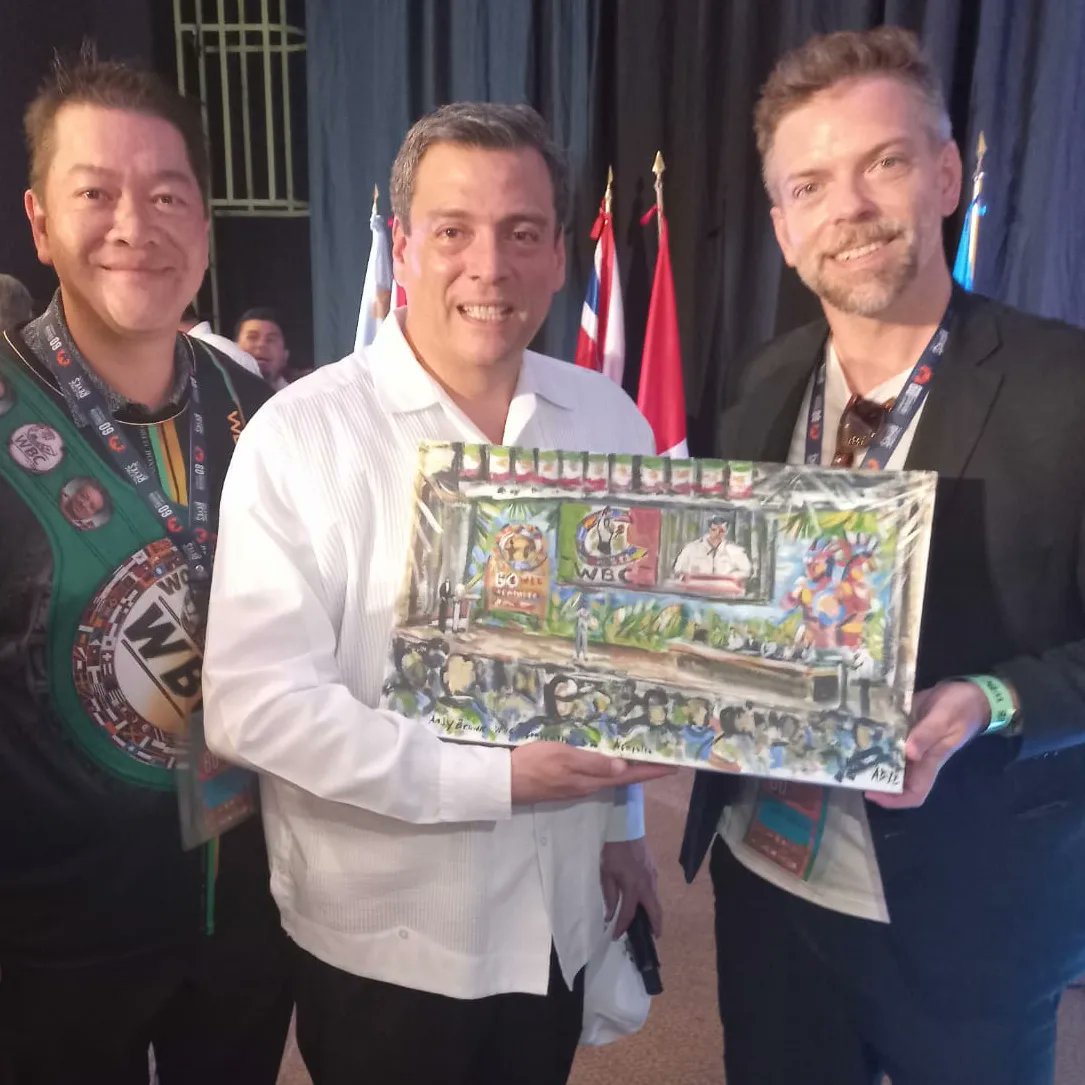 andybisanartist's tweet photo. With #worldboxingcouncil president Mr @wbcmoro and my painting of him speaking today @WBCBoxing convention 2022. https://t.co/HxhQieGAHS