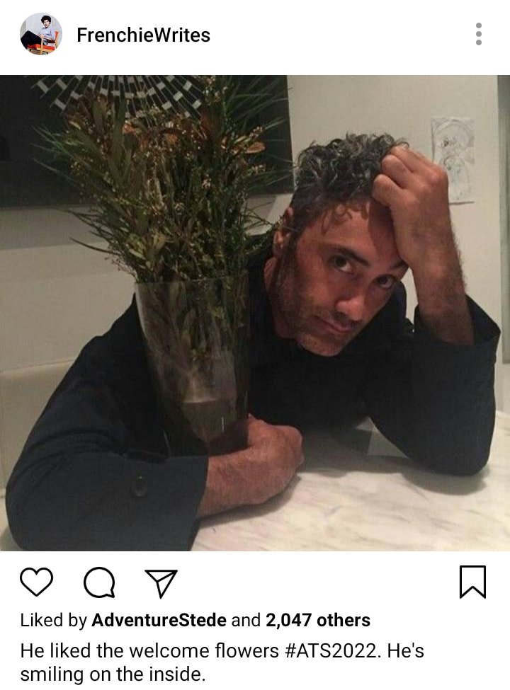 Frenchie's IG: Picture of Ed holding vase of flowers. Caption reads "He liked the welcome flowers #ATS2022. He's smiling on the inside. 