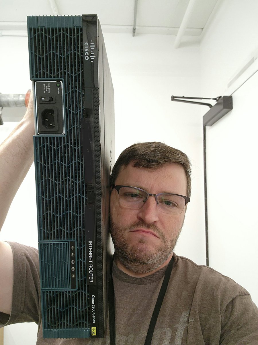 NetEng_Ian's tweet photo. Little known fact: If you hold a Cisco router like an '80s boom box, it plays the entire Licensed to Ill album by Beastie Boys. https://t.co/h5taMGmmce