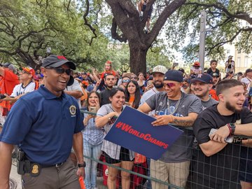 SAC Smith laughing with parade goers along the route.