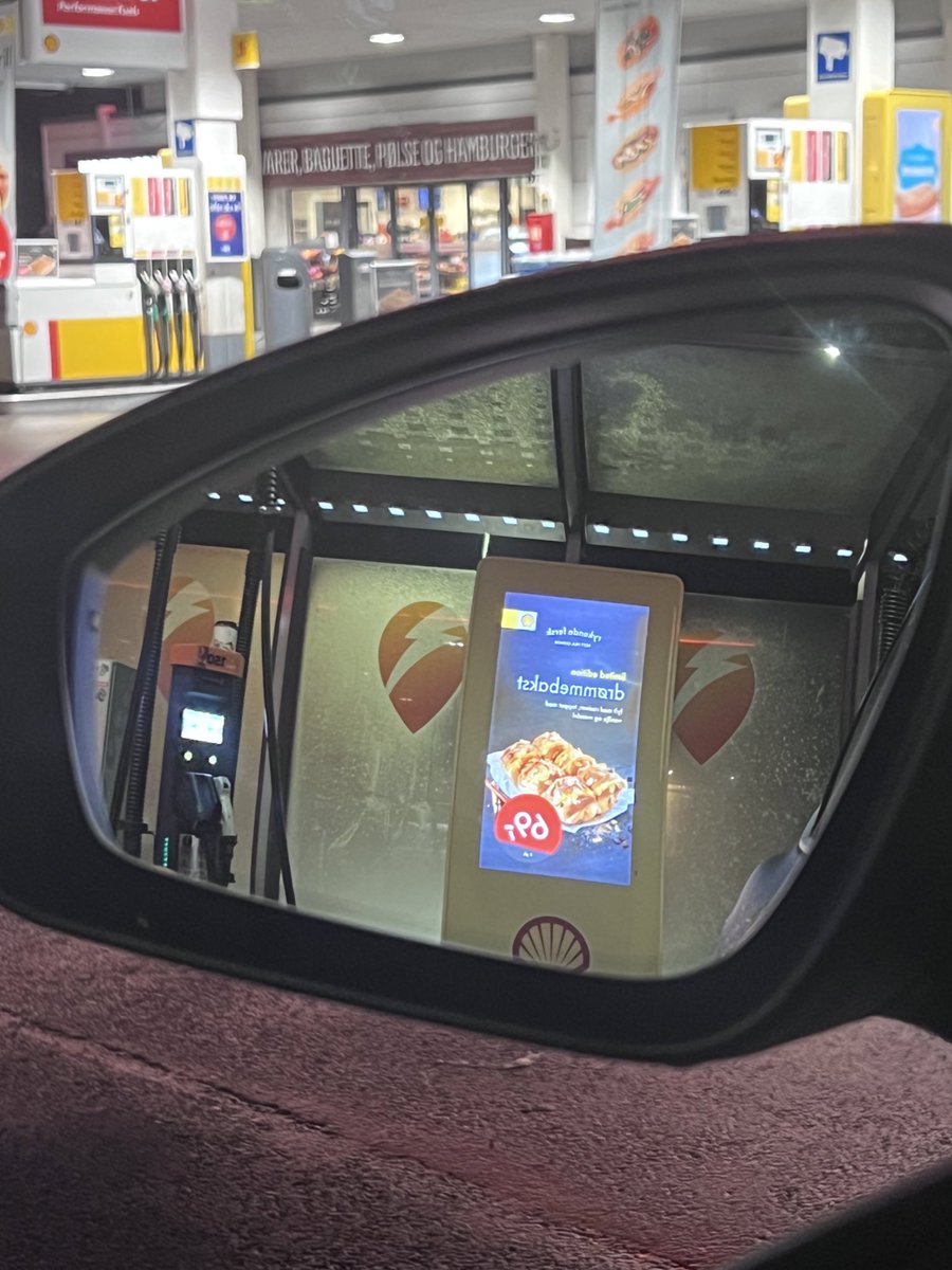 SkipTheBeatt's tweet photo. Hey @Shell, 

You should consider mirroring / reflecting your ads, so it makes sense when I’m looking in my side mirror when waiting for a full battery. Very sure people spend more time IN their cars than outside their car while charging. 

It’s a #UX #design thing. https://t.co/qIRg05H2iG