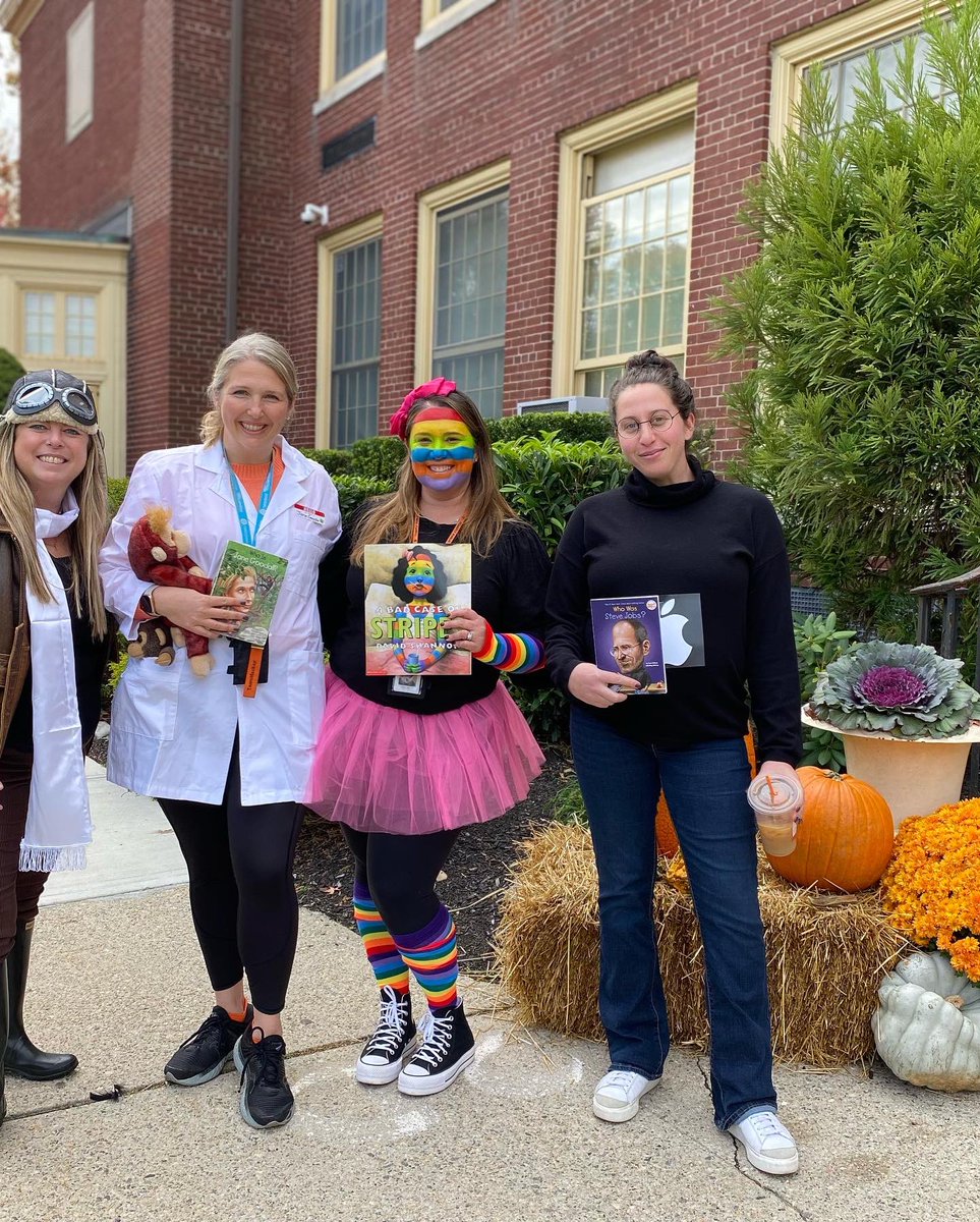 PrincipalMackay's tweet photo. Mackay Staff had another amazing Halloween “in the books!” Can you “read” our excitement?  #beststaffever #we🧡reading! @tenaflyschools https://t.co/sjY2biv4fm