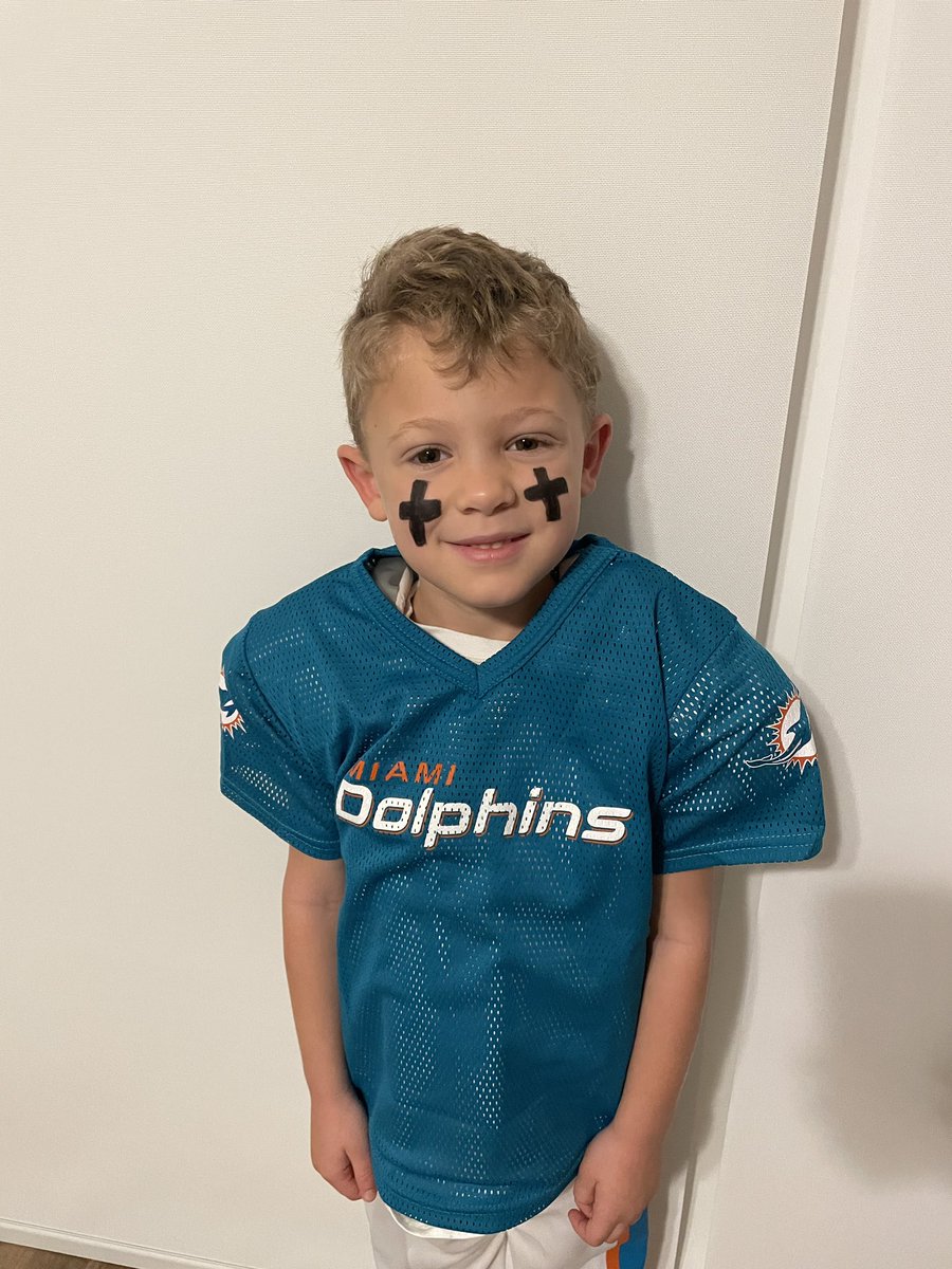 Mic_Marinelli's tweet photo. Happy Halloween 🎃! My son asked to be @Tua and he could not be any more excited to wear his costume to school! He made sure we put the crosses exactly how he has it!  #FinsUp #TuaTagovailoa #tua @MiamiDolphins Go 🐬 https://t.co/kb63fc6rMX