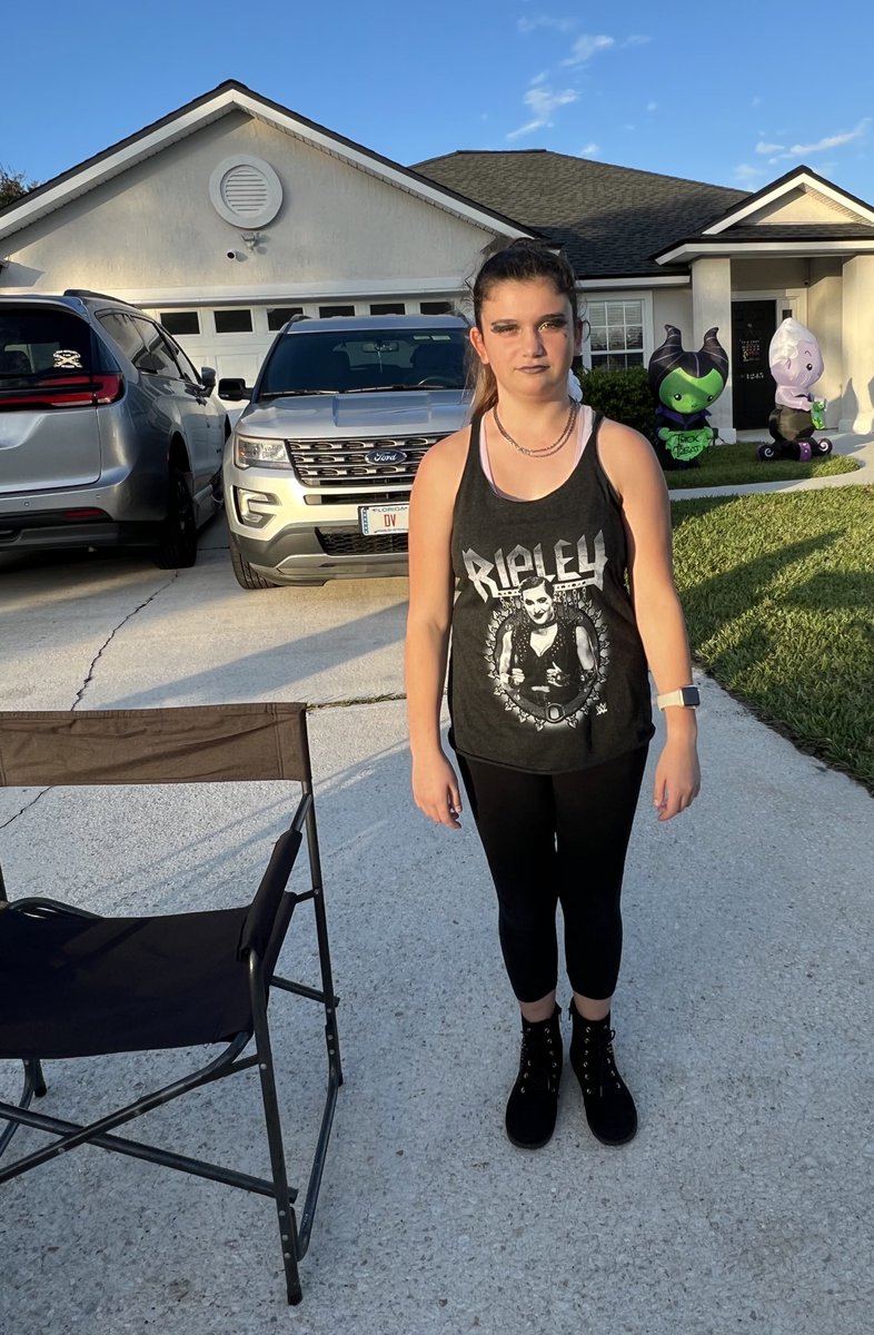 MunchkinLAB's tweet photo. Decided to go trick or treating last minute… but No costume?? No Problem!   She grabbed her newest tank of one of her Favorite @wwe superstars @RheaRipley_WWE and added makeup to match 🥰 #futureWWESuperstar https://t.co/Qy7Y3vXMLH
