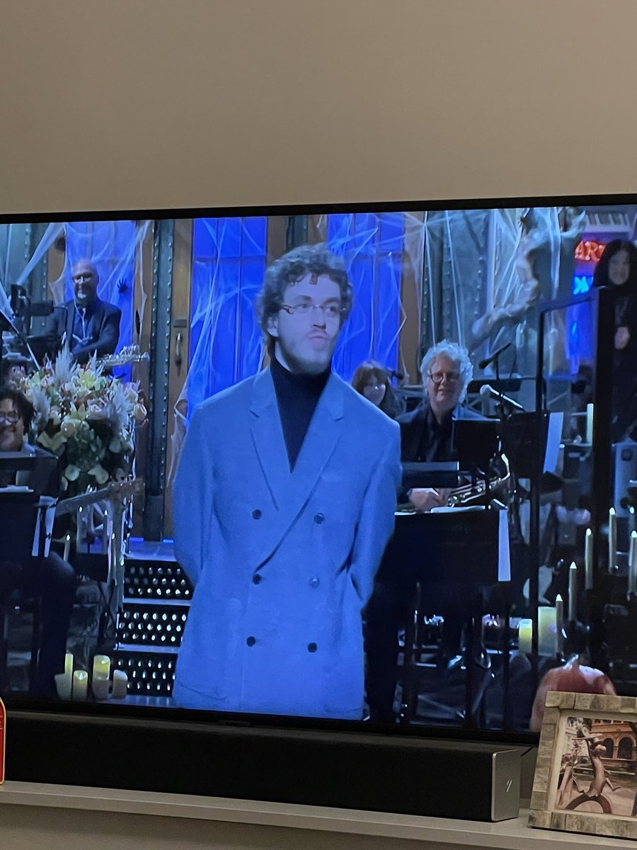 SauceWatch's tweet image. It’s great that Lenny Pickett’s nephew finally got to host the show. He looks so proud.  #SNL