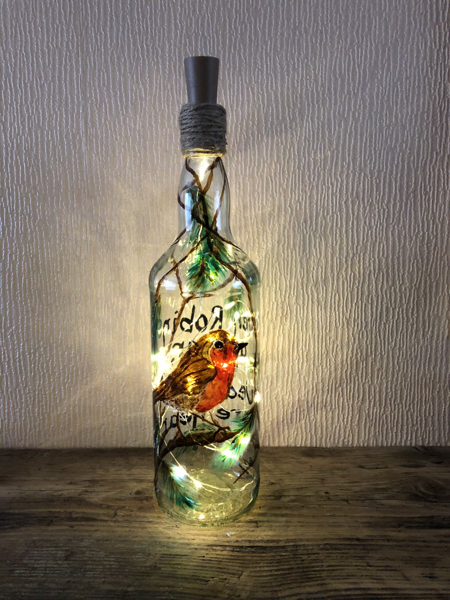 Beautiful Robin Art Light Bottle, hand painted, free hand no stencils or templates for full range of my glass art visit ebay.co.uk/usr/anne-mas-0 #glassart #uniquegifts #upcycledwinebottles #homedecor #cosylighting #robins #memorial #remembrance