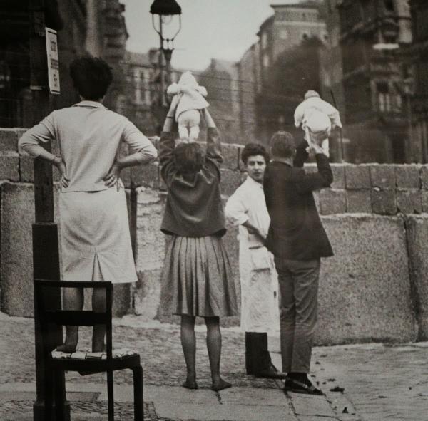 Residents of West Berlin show children to their grandparents who reside on the Eastern side, 1961