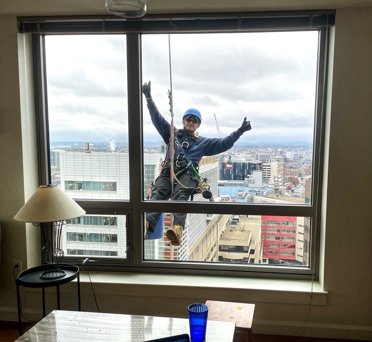 penelopetrunk's tweet image. I looked up and and saw the window washer and felt like I was living between the pages of Curious George Gets a Job. Then I remembered the building out an email: “Feel free to tag us in pictures today!!!” Even window washing is a complicated job in the age of social media.