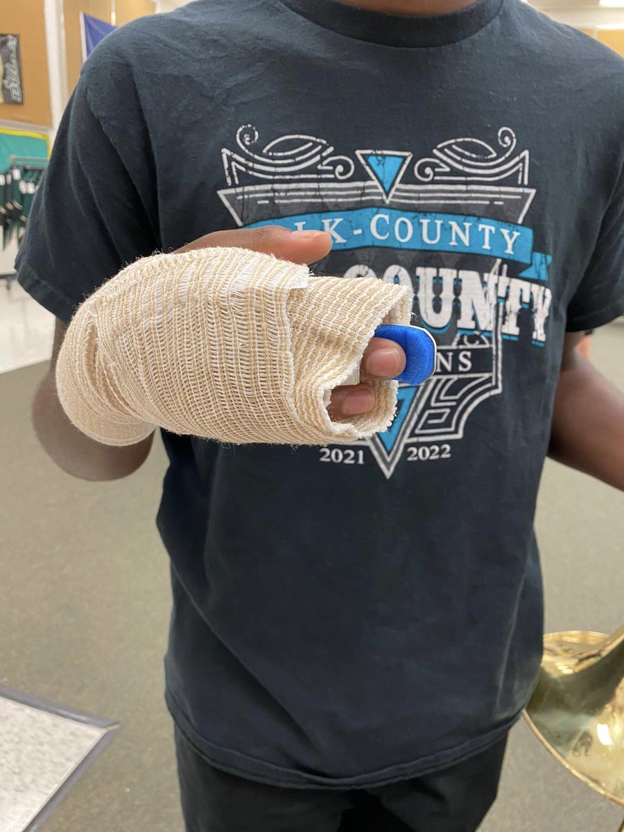 PolkSchoolsNews's tweet photo. George Jenkins High trombonist has broken fingers just before MPAs. GJHS engineering students 3D print a clip so he can play with his thumb. Not today, sad trombone! Read more: https://t.co/IOdU22KAZO 🎶 #lovePolkschools https://t.co/PXo3bW56sN