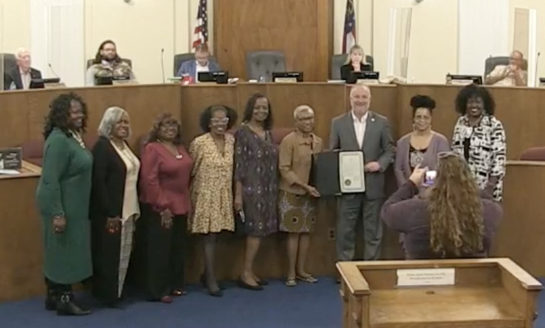 liz_lines's tweet photo. Commissioner Elaine Lucas reads @MaconBibb proclamation for declaring Nov 1 as #RetiredEducatorsDay with 141+K retired educators in Georgia. These 7 ladies worked 213 years!!! Not including educator Lucas. @maconnewsroom @mercerccj https://t.co/6HpnmINppr