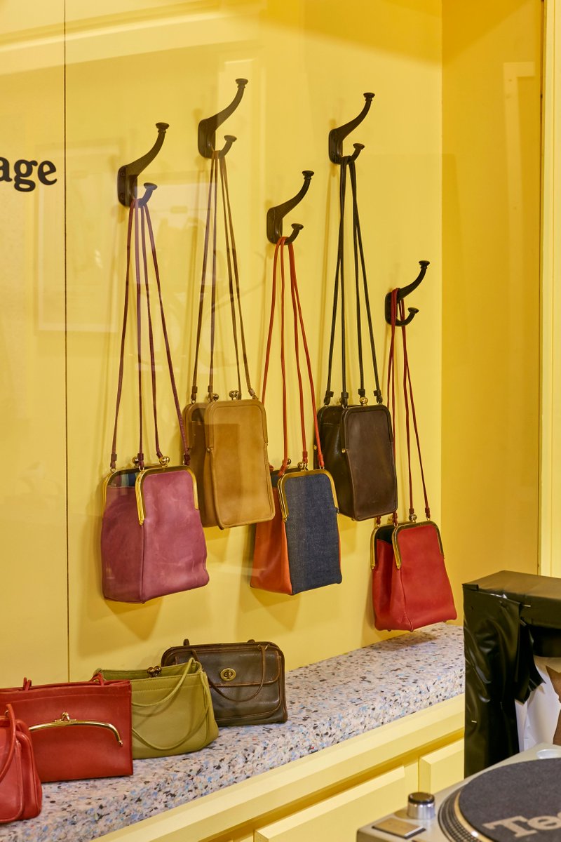 Coach's tweet photo. Come with us to our “Tomorrow’s Vintage” pop-up at Spitalfields! Our first-ever concept store in London, this shop celebrates our #CoachReLoved program and commitment to creating a better-made, circular future for all. #CoachE1 https://t.co/6dmVw5DJfb #CoachNY https://t.co/vMewc7FHFd
