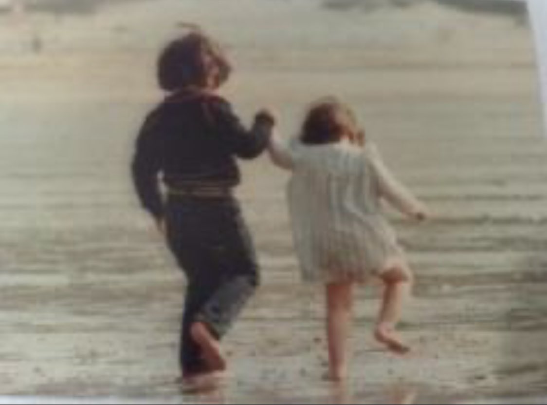 1982, let the 4 year old lead the 2 year old into the sea.