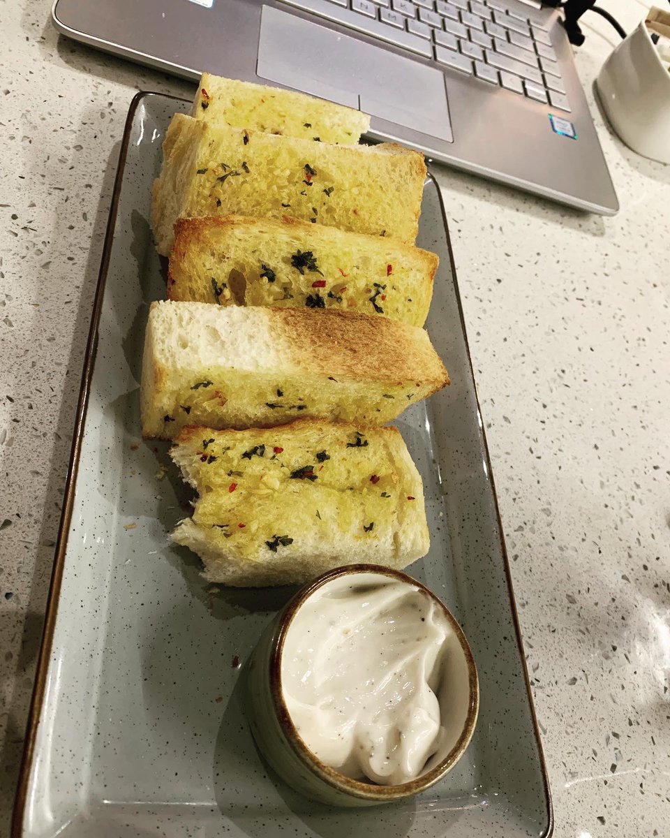 This is how my Tuesday went by… 
.
More caffeine and fooood 😇
.
#just #icedamericano #garlicbread #spinachfritters #work #workfromcafe to