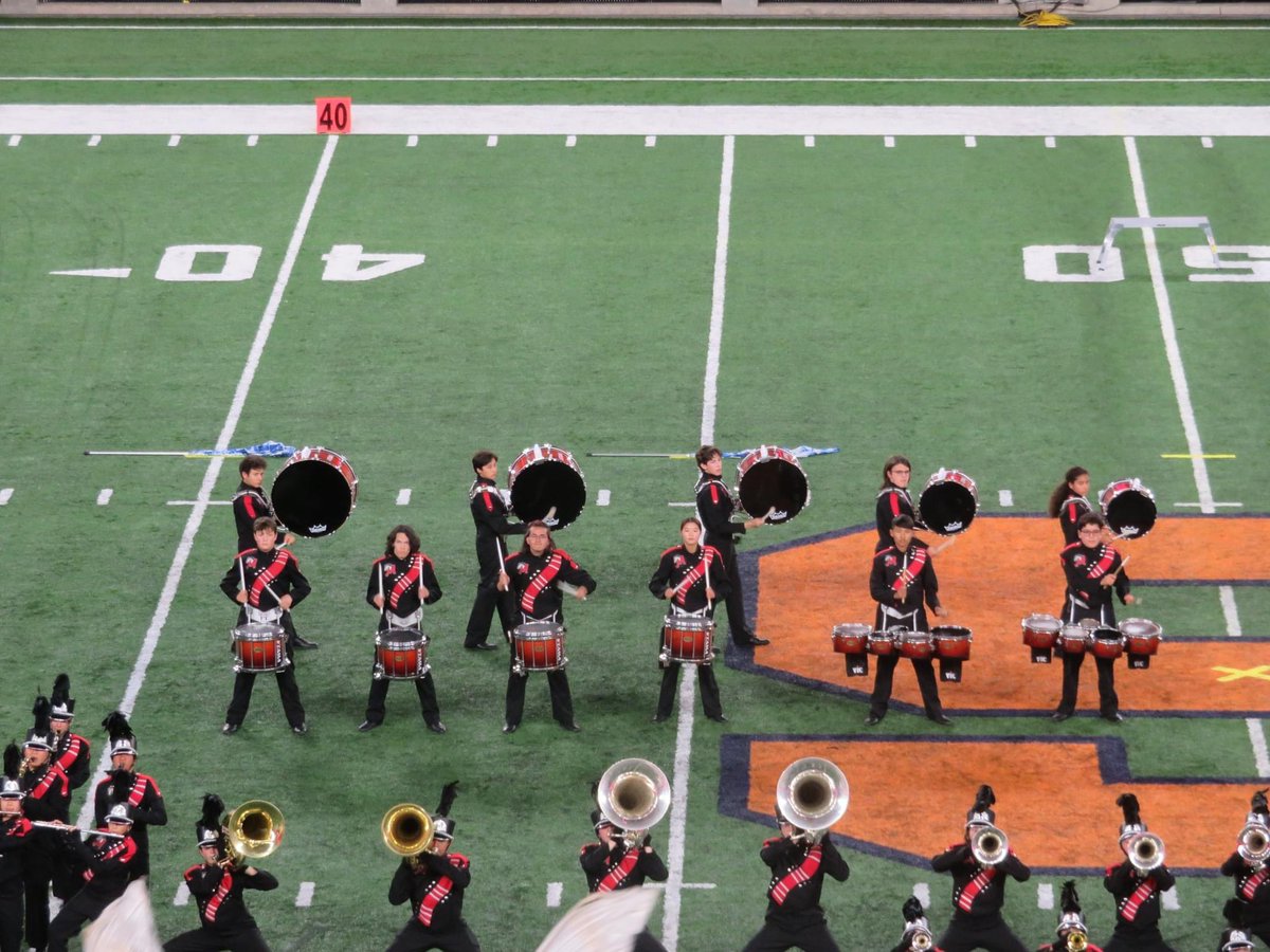 DebTobar's tweet photo. So #MineolaProud of Adam and the Mineola Marching Band for winning first place in their division at the @NYSFieldBand state championships this weekend in Syracuse! ❤️🤍🖤 https://t.co/iG3TfGpook