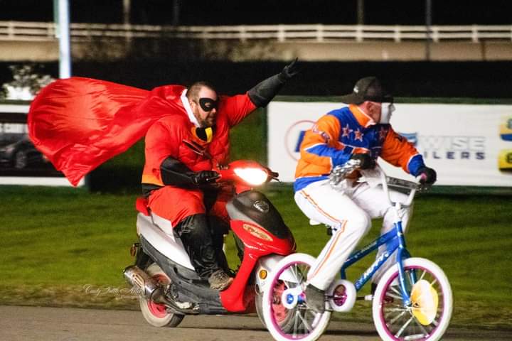 Wheelsbyjoe's tweet photo. Mr. Incredible himself, Joe Harrington who illegally entered and won the bicycle race on a MOPED!Leon Bailey was pedaling at breakneck speed with a clear path to the finish line until Joe came from out of the shadows doing over 20mph dressed as Mr. Incredible to barely pass Leon. https://t.co/k4Ge6d5u2c
