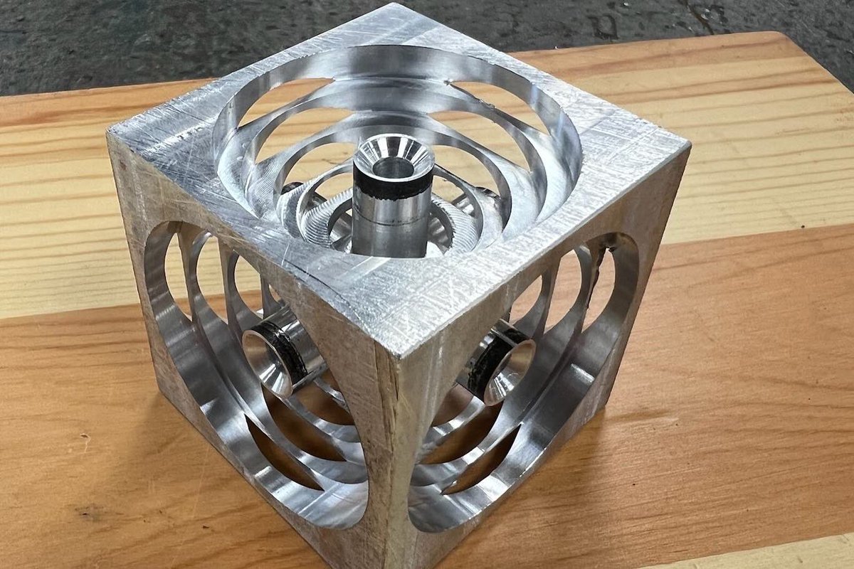 dmtcsc's tweet image. Grayson Grazel, a Broome High School freshman, is shown with his completed Turner’s Cube project.  He designed and programmed the part in Fusion 360, then set up the CNC Machining center to machine the finished product.  Great job, Grayson!  #DMTCPrepares #MachineToolTechnology