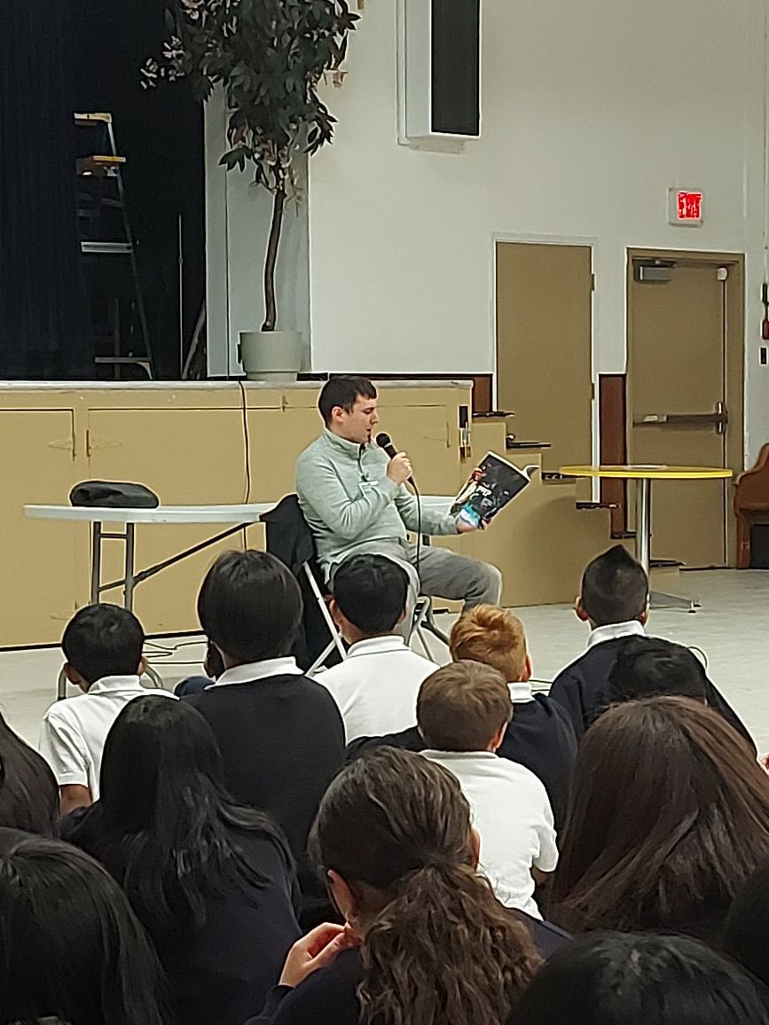 OLGCSurrey's tweet photo. Today for I Read Canadian Day, we had local writer @TJKWrites come to the school and read one of his short stories. @CISVA2 #cisva #olgcbestinbc https://t.co/46xFKeyvtW