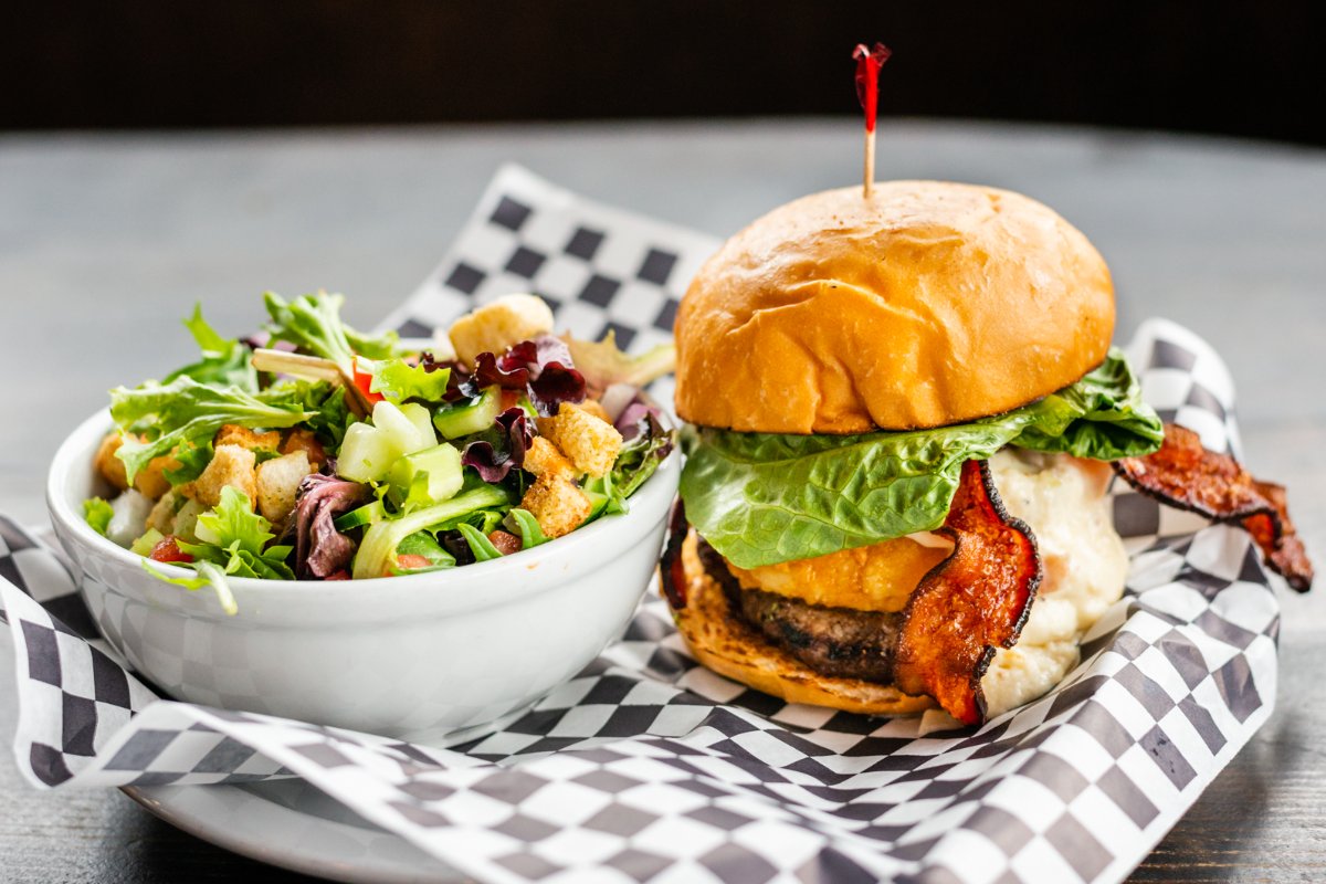 We call it balance. You call it delicious! Stop by today to get a burger and side salad of your own. #ElDoradoSaloonAndGrill