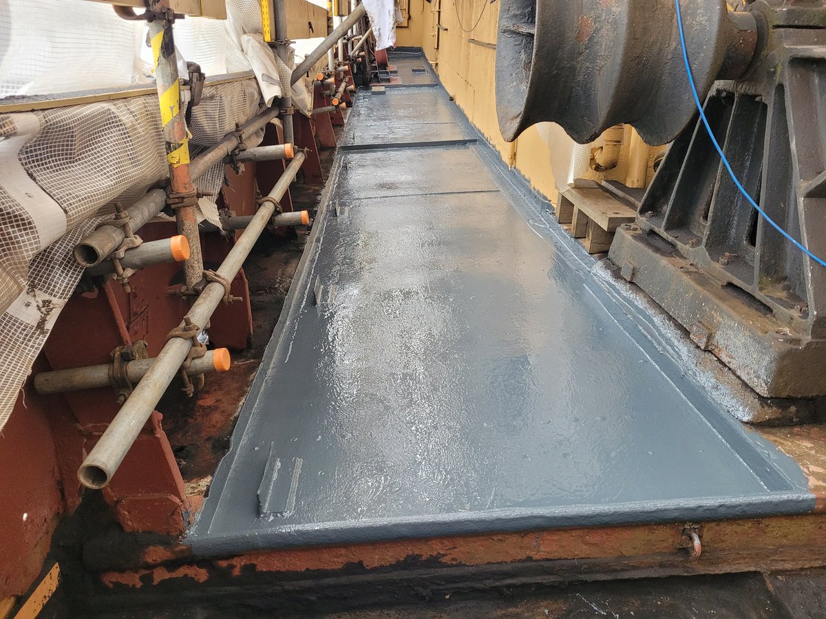 This morning, the deck from the starboard quarter up to the trawl winch was then blasted to clean away corrosion, revealing the riveting and the wonderful looking steel plate beneath. The blast material is cleaned away and a coat of protective paint immediately applied.