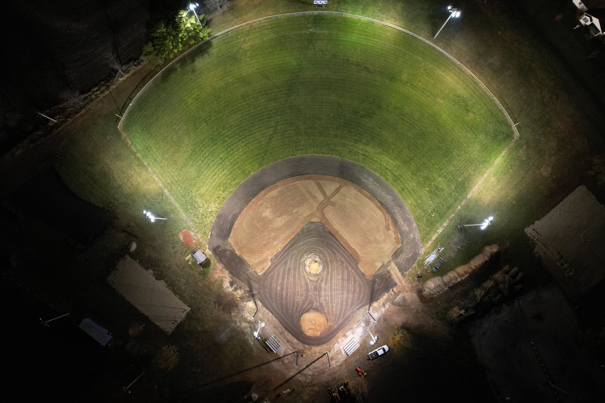 ProfOutdoorSol's tweet photo. A little grading under the lights tonight. Irrigation installed, getting close to sod, warning track and building the mound… #finishlineinsight https://t.co/DcFo92Rvh3