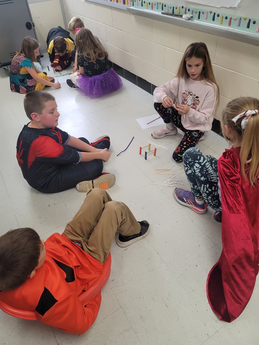 MorganMueth's tweet photo. Halloween Day fun! Working together to make Bone Bridges! Whose bridge will hold the most candy pumpkins!?!? These third graders got very creative and had so much fun! #redbud132 https://t.co/GmpyGEwUh8