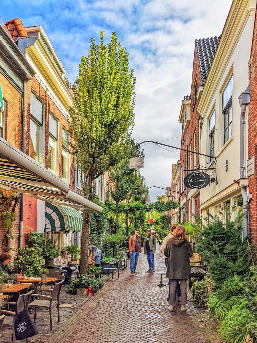I recently posted the image R here. The chef of the 'Ti Bisou' creperie in the picture has just sent me L image - the *same street* a few decades ago!  Apparently residents led the transformation. A reminder of what is possible.
