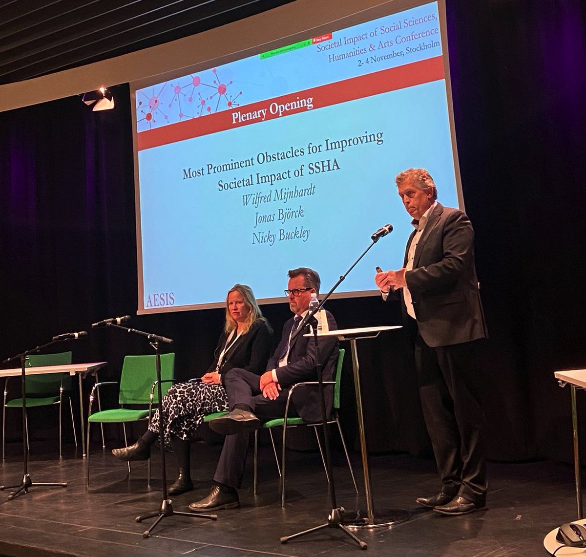 AesisNet's tweet photo. We begin Day 2 of our conference with an opening plenary on 'Most Prominent Obstacles for Improving Societal Impact of SSHA,' where we hear from our speakers @wmijnhardt @bjorck66 @NickyBtenten about the challenges they've engaged with in their research institutions.

#SSHA22 https://t.co/T4QPAGkBZs