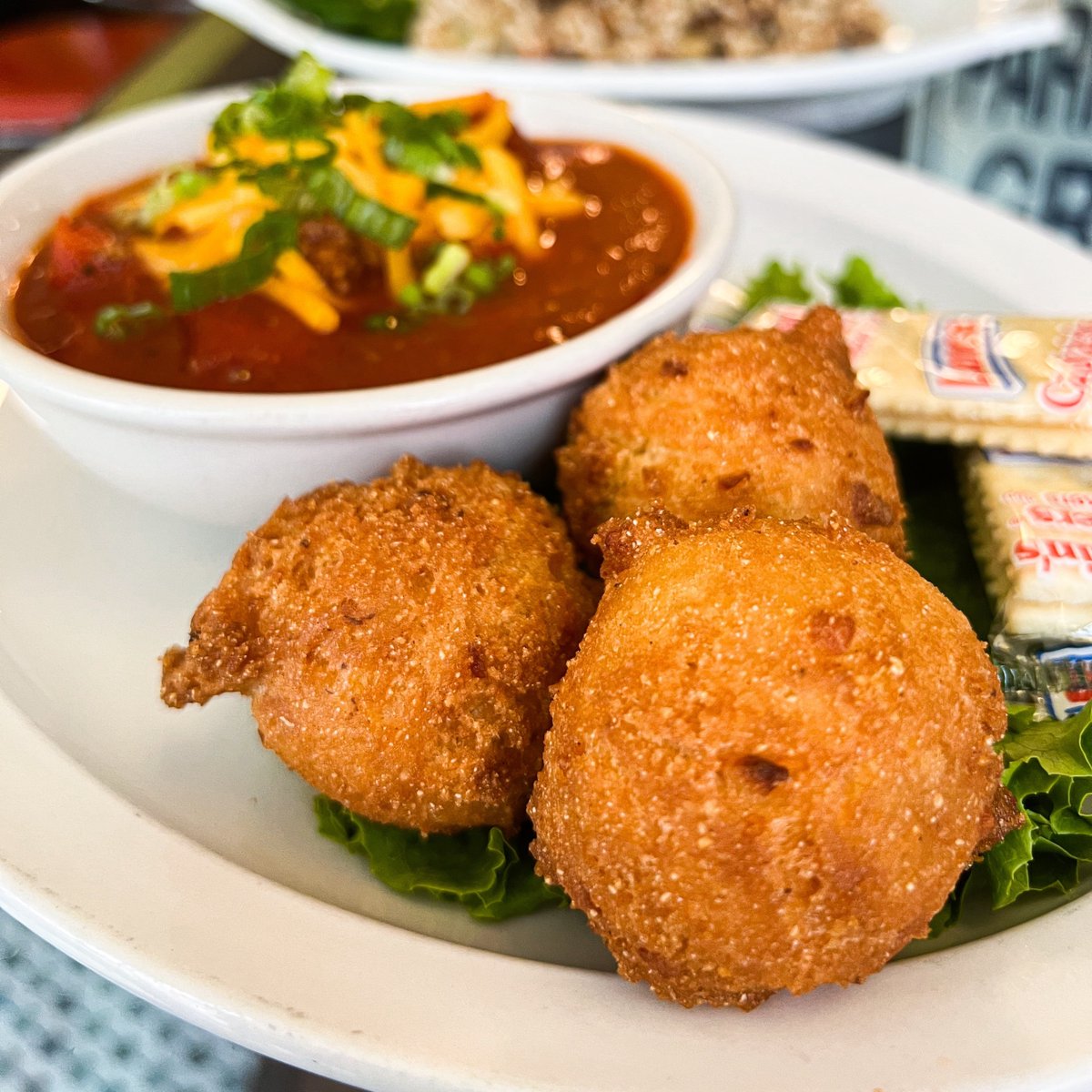 Chef D's servin' up a hearty bowl of chili with jalapeño cheddar hush puppies today through the weekend!
