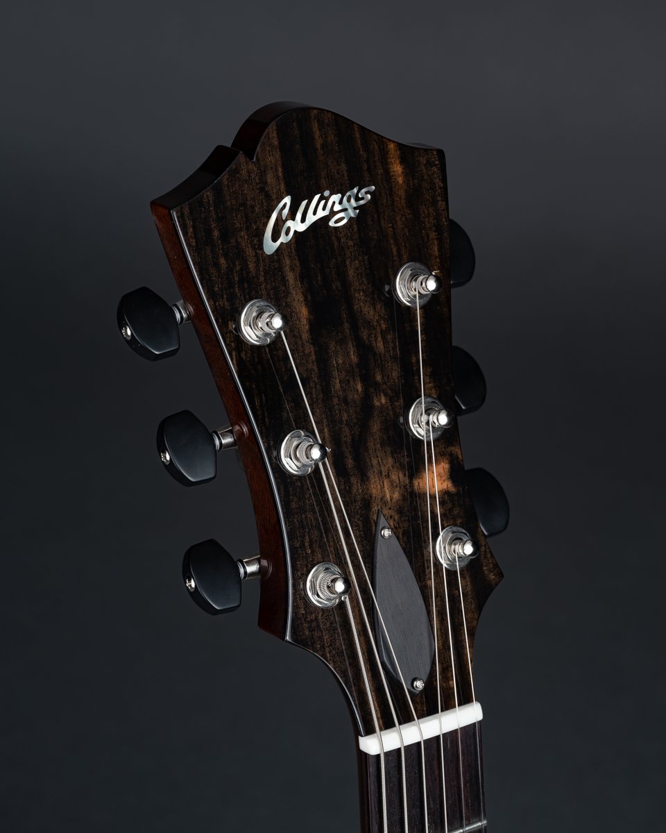 Our Flared Haircut peghead with ebony veneer and truss rod cover. #handmade #electricguitar #atx #collingsguitars