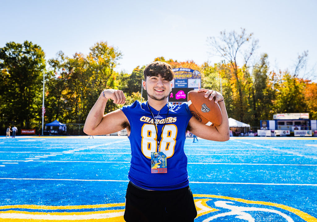 NCAA's tweet photo. The @UNHChargers Student-Athlete Advisory Committee brought Anthony’s wish of having a pool to life with a pool party-themed wish reveal at a recent football game.
 
@NCAADII has been a @MakeAWish partner since 2003, granting more than 760 wishes.💫

#MakeItYours x @MakeAWishCT https://t.co/2rlEYTnsa5