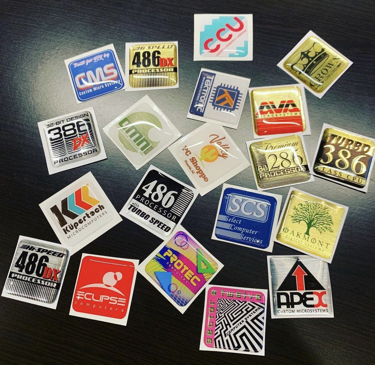 geekenspiel's tweet photo. Some of my original “Mom &amp; Pop Shop” &amp; Processor badges very naturally arranged on a table. 😉 https://t.co/vamPqg4zRT